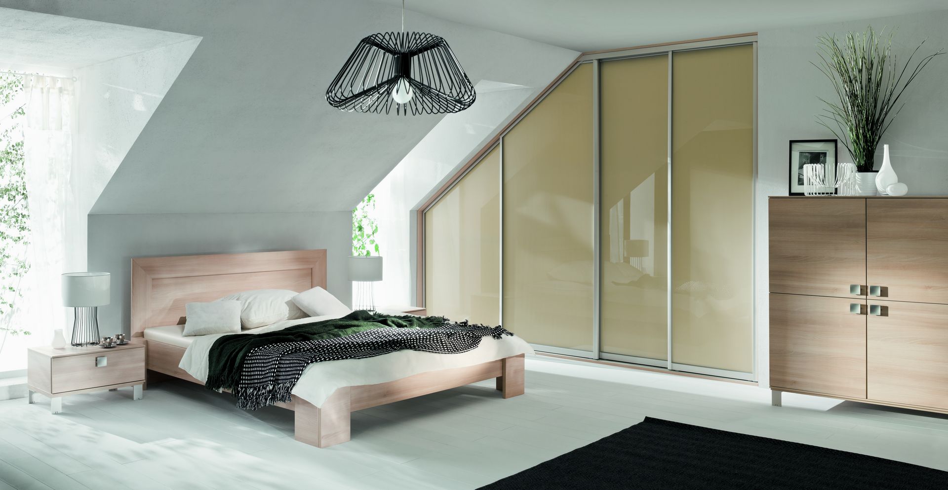 Szafy z drzwiami ze skosem w sypialni Komandor